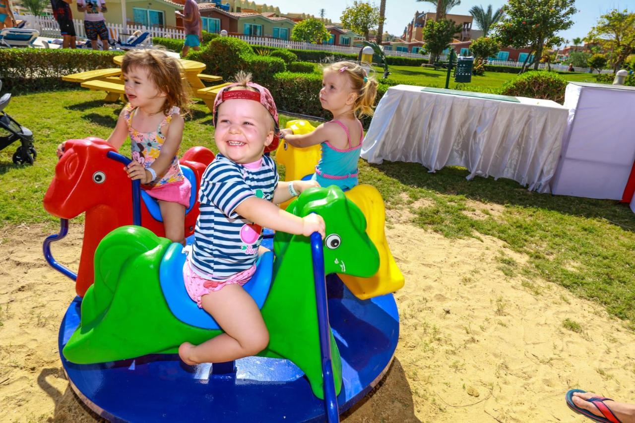 Titanic Palace Families And Couples Only Hurghada Extérieur photo Children playing on a carousel